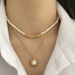 Elegant s925 silver double-layer necklace set with freshwater pearls on a model