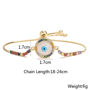 Detail of adjustable golden evil eye bracelet with colorful zircons and size annotations