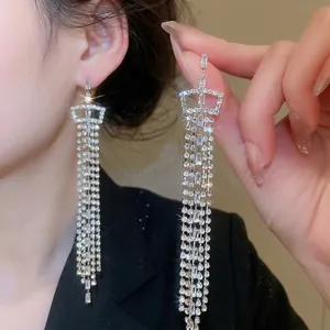 Elegant silver tassel drop earrings with crown design and sparkling white zircons