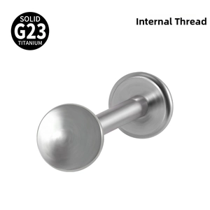 Detail view of solid G23 titanium labret stud with internal thread and flat base design