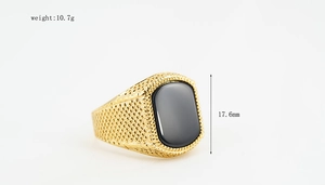 Detail view of gold punk ring with black square obsidian stone measuring 17.6mm in height