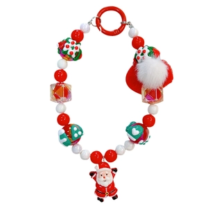 Festive Christmas beaded phone strap with Santa Claus charm and fluffy pom-pom detail