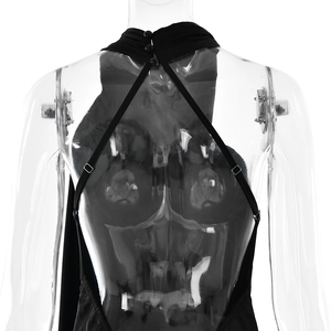 Detail view of black halter-neck backless top with crossover straps and neck button closure