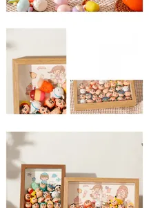 Deep shadow box frame in light wood finish for displaying 3D cartoon dolls and collectibles
