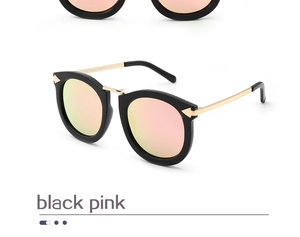 Detailed side view of black cat eye sunglasses with pink polarized lenses and UV400 marking