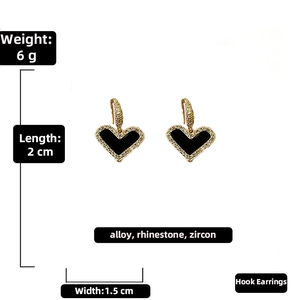 Detailed dimensions of gold heart drop earrings with black center and sparkling zircons