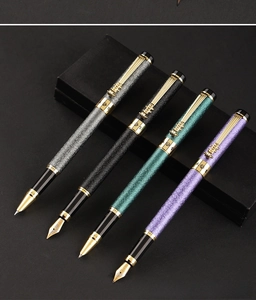 Close-up of four matte stone texture pens with unique golden abacus clips in a gift box
