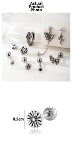 Detailed view of silver butterfly and flower earrings with 0.5cm diameter measurement