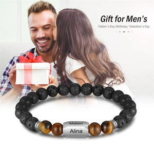 Custom engraved men's bracelet with black volcanic rock and brown tiger eye stone beads