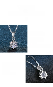 Detail view of a 925 sterling silver moissanite necklace with a classic six-prong setting