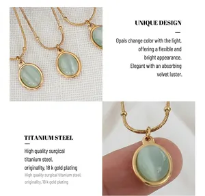 Macro detail of oval green cat eye stone pendant on 18k gold plated titanium steel chain