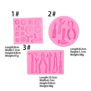 Moldes de silicona rosa para decoraciones de fondant con formas de herramientas