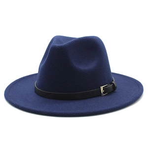 Detail of navy blue wool fedora hat featuring a black leather belt with gold metal buckle