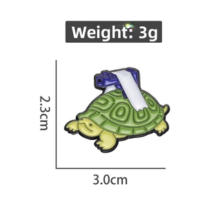 Detail showing cartoon green turtle pin dimensions 3.0cm by 2.3cm and 3g weight
