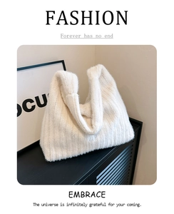 Detail of soft white plush faux fur texture on a minimalist aesthetic shoulder tote bag