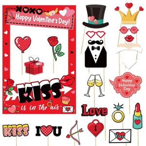 Flat lay of 2025 Valentine's Day paper photo frame and diverse hand-held photo props