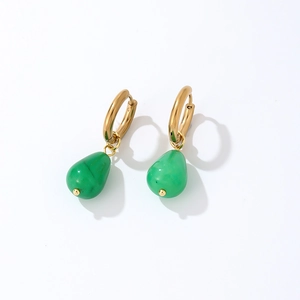 Detail of gold hoop earrings with natural green teardrop stone pendants on white background