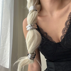 Three silver alloy hair cuffs shown on a braided ponytail for a stylish metallic look
