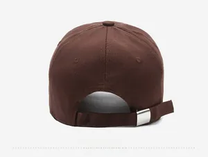 Close-up of the back of a brown baseball cap showing adjustable strap and silver metal buckle