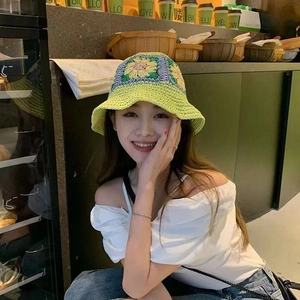 Foldable crochet straw sun hat with colorful floral patterns and wide brim for women
