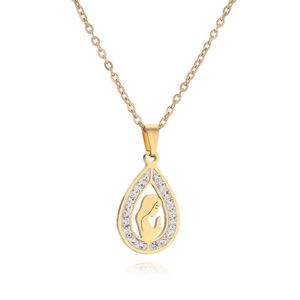 Detailed close-up of gold teardrop pendant featuring a central saint icon and zircon stones