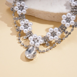 Two-piece layered necklace with pearl flower motifs and a large teardrop rhinestone pendant