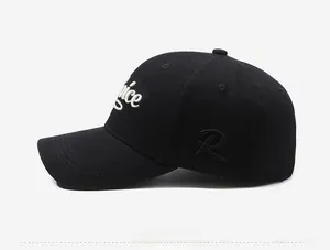 Detailed side view of black baseball cap featuring 3D white embroidery and curved brim