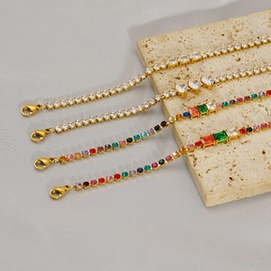 Detail view of four gold-plated tennis bracelets with various zircon cuts and lobster clasps