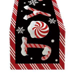 Christmas JOY table runner with candy cane pattern and festive snowflake designs