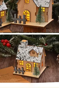Detail showing the glowing wooden Christmas house with LED lights and miniature pine tree