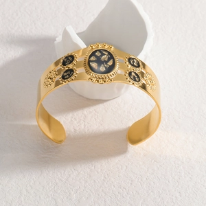Bracelet jonc en forme de C en acier doré 18 carats avec incrustation de feuille noire