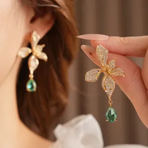 Vintage zircon orchid drop earrings with emerald green teardrop stones in gold plating