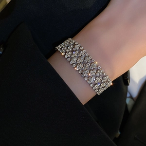 Close-up of wide multi-row rhinestone bracelet with sparkling crystals on wrist