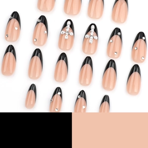 French black tip almond press-on nails with silver rhinestones and cross designs