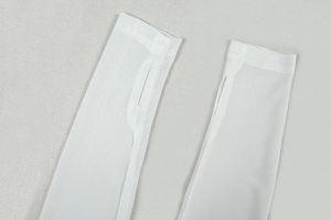 Detail view of white ice silk sun sleeves with thumb holes and breathable mesh fabric