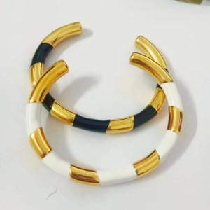 Minimalist 18k gold plated stainless steel bangles with black and white enamel checker pattern