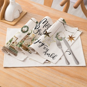 Christmas cotton linen table mat featuring Merry & Bright patterns on wood table