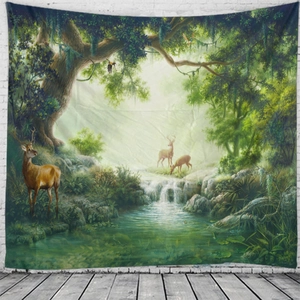 Detail view of large forest tapestry with deer and waterfall hanging on a white wall