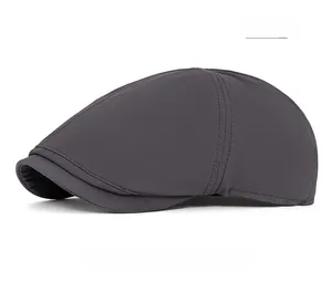 Detail view of quick-dry dark gray flat cap showing side stitching and breathable fabric