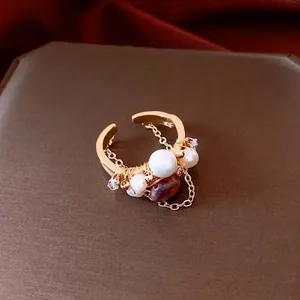 Vintage 18k gold plated pearl open ring with wire wrap design and red gemstone detail