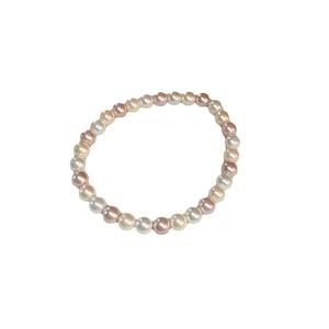 Elegant freshwater pearl bracelet featuring white, beige, and soft purple round beads