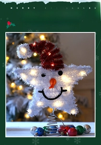 Detail of a lighted Christmas tree topper snowman with red hat and LED silver spring base