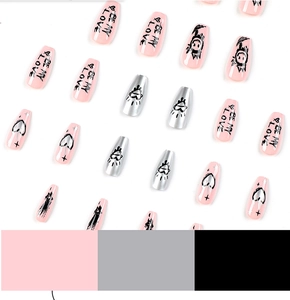 Detail of pink and silver coffin press-on nails with heart graffiti and black art text