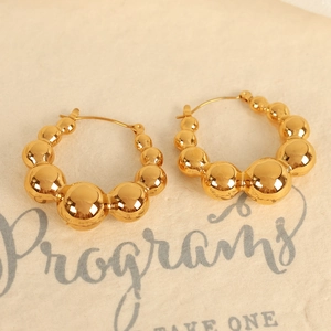 Minimalist gold droplet earrings with high-polished metal finish and geometric sphere design