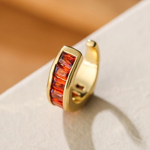 Elegant 18K gold plated ear clip with red square-cut zircon stones in channel setting