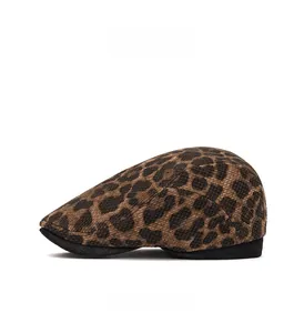 Side view detail of leopard print newsboy cap showing textured knit fabric and brim
