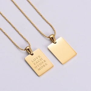 Golden rectangular love pendant necklace with ball chain and polished finish