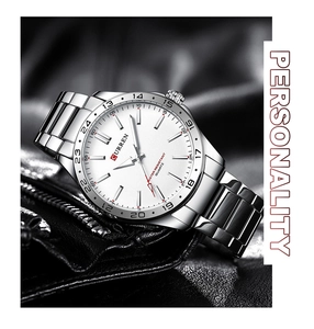 Detail of silver stainless steel watch with white dial and 24h bezel on black leather