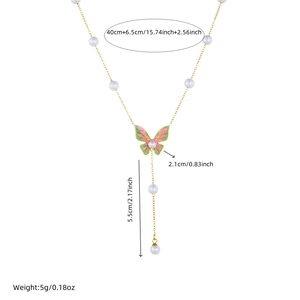 Elegant gold Y-shaped necklace with colorful enamel butterfly and pearl tassels