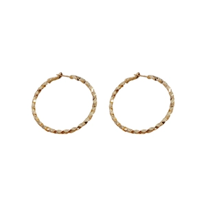 Chic golden irregular round hoop earrings with sparkling diamond-cut texture on white background
